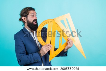 back to school. measure and size. surprised mature teacher holding triangle and protractor tool. bearded man engineer work with ruler. prepare for geometry exam. architecht or lecturer on math lesson