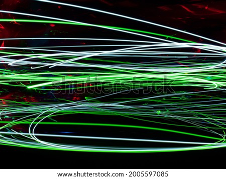 green lines of light on a black background