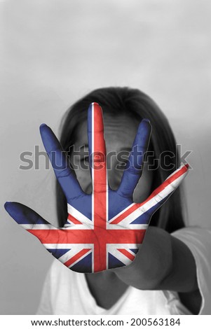 woman with her hands signaling to stop and England flag