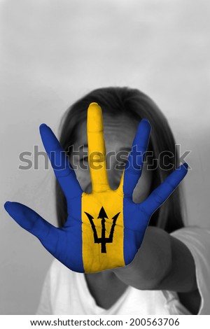 woman with her hands signaling to stop and Barbados flag