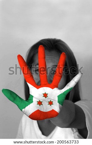 woman with her hands signaling to stop and Burundi flag