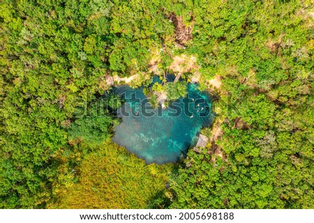 Heart shaped cenote in the middle of a jungle in Tulum, Mexico. Beautiful heart in nature. Romantic love style concept. Royalty-Free Stock Photo #2005698188