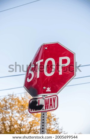 A stop sign with the sky behind it.