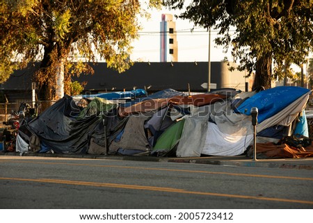 A homeless encampment sits on a street in Downtown Los Angeles, California, USA. Royalty-Free Stock Photo #2005723412