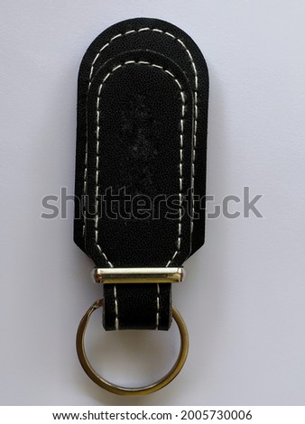 black key chain holder with white background
