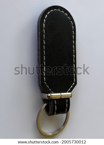 black key chain holder with white background