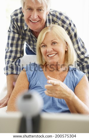 Senior couple using skype