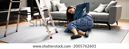 Clumsy Women Falling Ladder Incident. Injured Person On Floor