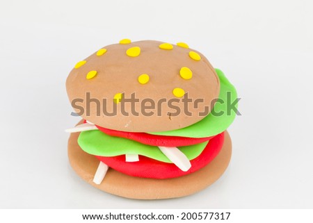 Hamburger from children bright plasticine - Stock Image macro.