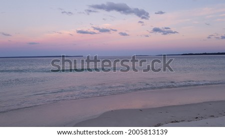 Pink and Purple Sunset over Beach and Calm Waters of Jervis Bay 