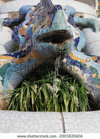 Lizard fountain at park Guell in european Barcelona city at Catalonia district in Spain in 2019 warm sunny summer day on September - vertical