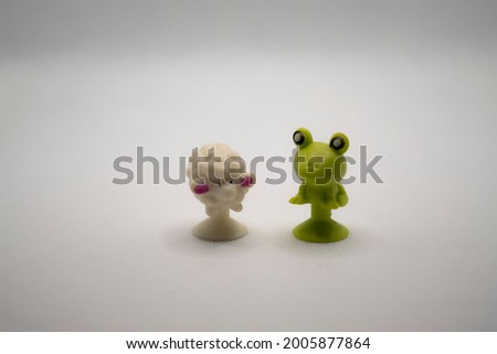two cute toys. lamb and toad. isolated objects. macro shooting