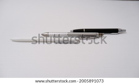 Top view of tree set isolated pen office stationary in white background.