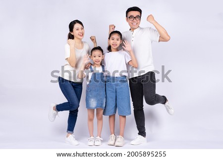 Portrait of Asian family on white background Royalty-Free Stock Photo #2005895255