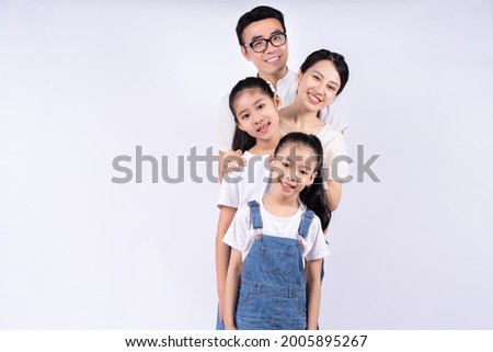 Portrait of Asian family on white background Royalty-Free Stock Photo #2005895267