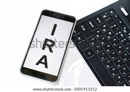 Having a IRA inscription on the phone screen that lies on the laptop keyboard