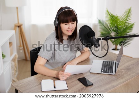 journalism, news, audio content making, podcast and blogging concept - woman podcasting and recording online talk show at home