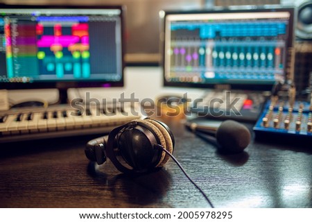 Headphones on the table, recording studio interior