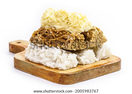 typical Brazilian sweet, called cocada, made at home. Isolated white background with copy space