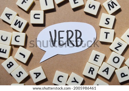 Top view image of Verb wording with scattered word. Education concept