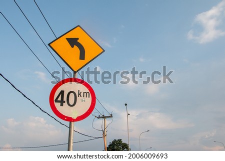 a road sign and clear blue sky
