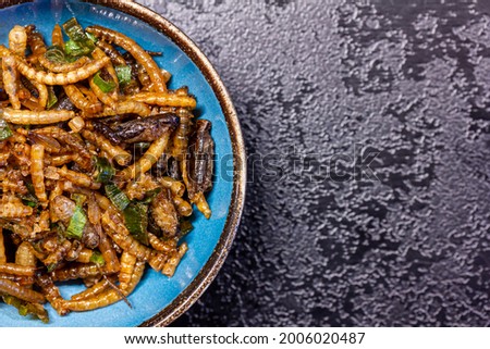 fried mealworms and spring onions in a bowl Royalty-Free Stock Photo #2006020487
