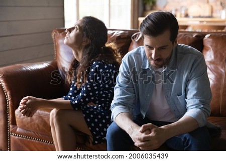 Young married couple going through relationship problems, divorce, Annoyed tired husband and wife keeping silence and ignore after arguing, quarrel, fighting. Family crisis, breakup, stress concept Royalty-Free Stock Photo #2006035439
