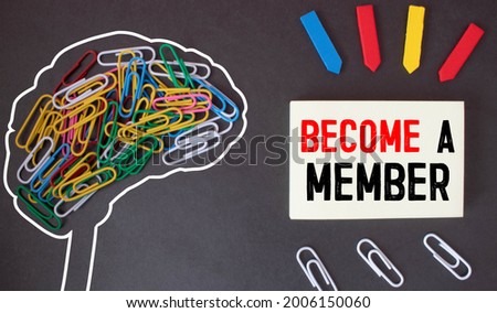 Top angle view of pen and notebook written with text BECOME A MEMBER. Business and education concept.