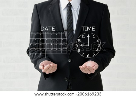 A business man raising calendar and clock 