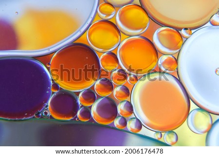 abstract photo of oil drops float on a water