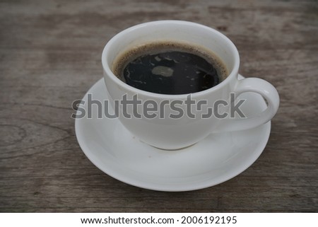 black coffee, white mug, wooden table top, wood grain, illustration, concept, idea