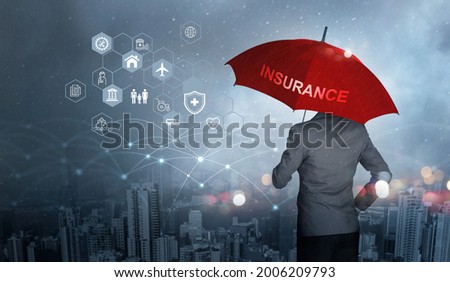 Insurance concept, Businessman holding red umbrella on falling rain with protect with icon business, health, financial, life, family, accident and logistics  insurance on city background Royalty-Free Stock Photo #2006209793