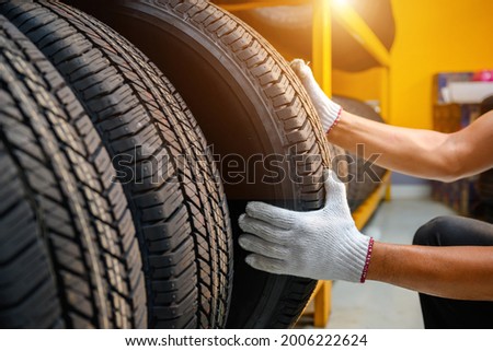 Auto mechanic change new tire in stock to change for customers in garages or service centers or auto repair shops Tire depot for the automobile industry Change wheelstires