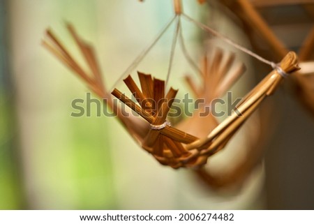 Baltic and Scandinavian traditional Christmas decorations from reeds or straw decorated with pieces of wood.