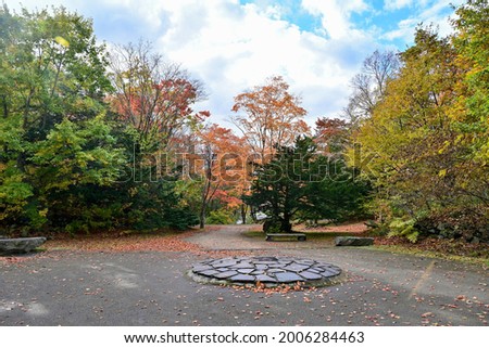 Scenery of Onuma Park square surrounded by autumn leaves in full bloom at Hokkaido