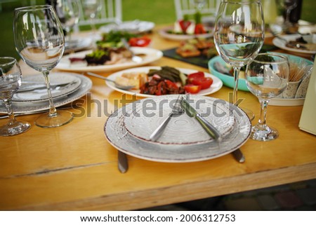 Served For Banquet Restaurant Table With Dishes, Snack, Wine Glasses