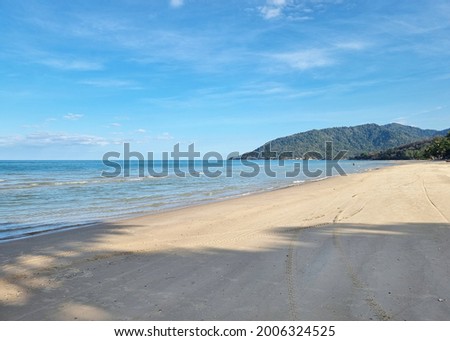 Sea, and blue sky with clouds and waves on the beach along the coast of the Gulf of Thailand.