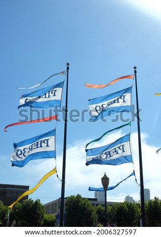 flags flying from Pier 39 in San Francisco, California, USA