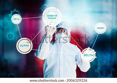 Male doctor wearing hazmat suit while touching the button virtual screen with Covid-19 variants text