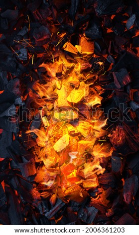 Red and hot pieces of coals or smolders after fire stopped burning. Top view.