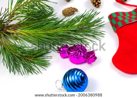 pine branch pine cone and santa claus stocking on a white background. High quality photo