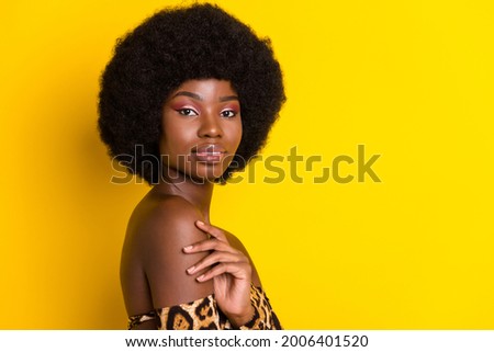 Photo of adorable charming dark skin lady wear off-shoulders clothes empty space smiling isolated yellow color background