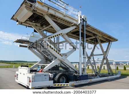 Service Vehicle, Aircraft Cargo Loader, Airport, Passenger Service. Royalty-Free Stock Photo #2006403377