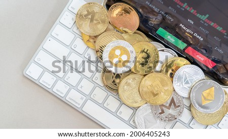 Cryptocurrency on Binance trading app, Bitcoin BTC with BNB, Ethereum, Dogecoin, Cardano, Litecoin, altcoin digital coin crypto currency defi p2p decentralized finance and fintech banking market Royalty-Free Stock Photo #2006405243