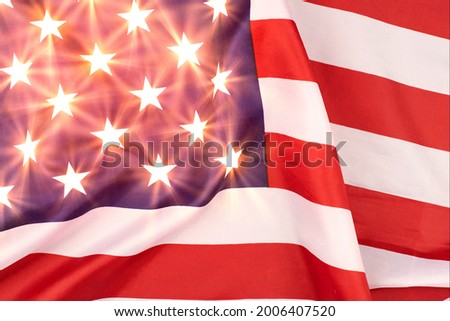 United States of America flag. Glowing stars on USA flag, patriotic symbol of America. Close up flag waving in wind.