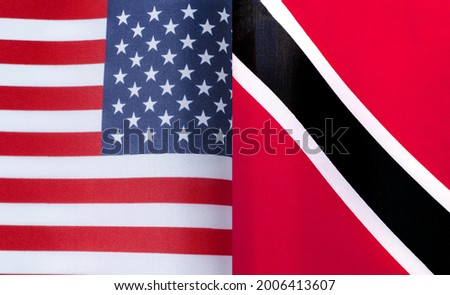 fragments of the national flags of the United States and Trinidad and Tobago close-up