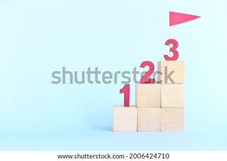 123 numbers on stairs wooden blocks. Small steps towards goal or step by step to success concept. Royalty-Free Stock Photo #2006424710