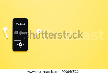 Podcast icon. Audio equipment with microphone, sound headphones, podcast application on mobile smartphone screen. Radio recording sound voice on yellow background. Broadcast media music concept