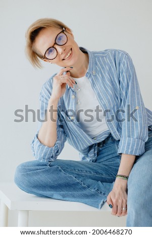young adult beautiful European woman model poses, portrait of a white woman, happy Caucasian woman smiling and enjoying life, hair and skin care beautiful and cheerful woman with short white hair