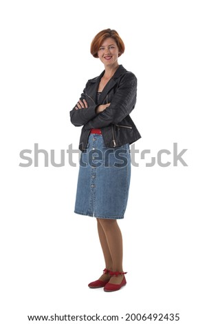 Casual smiling woman standing with arms folded in full length isolated on white background